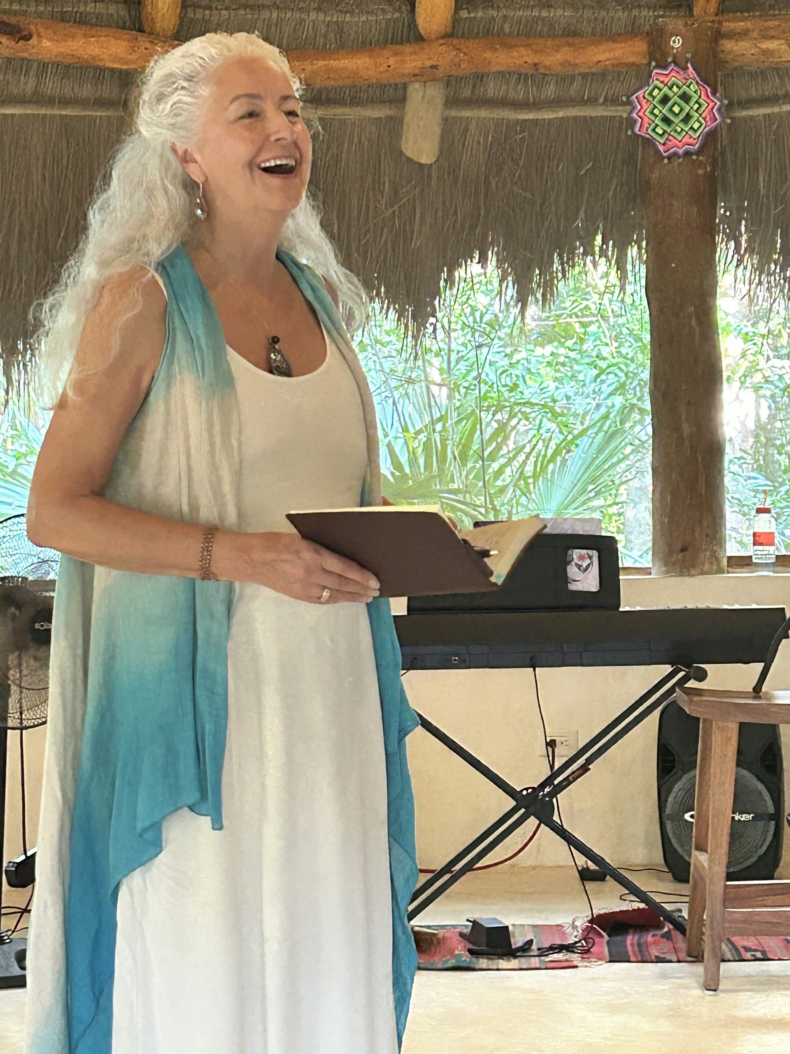 Maureen singing with her hand over her heart